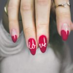 red and white manicure with love print