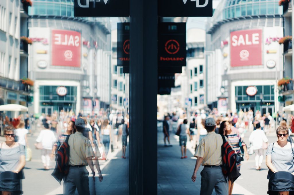 people walking beside buildings