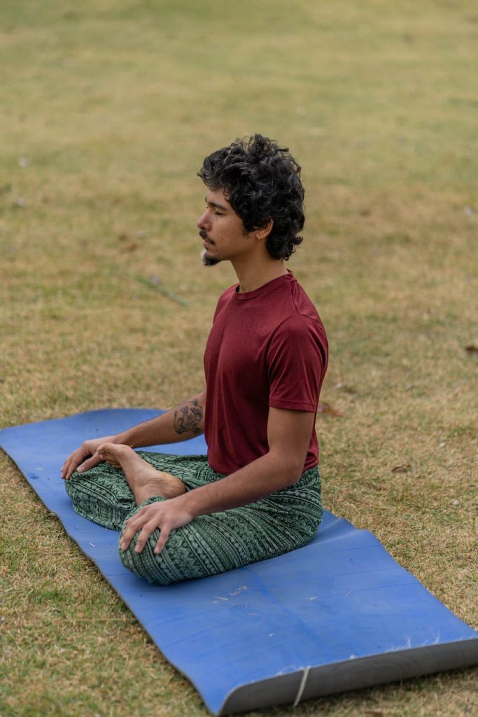 man meditating on mat