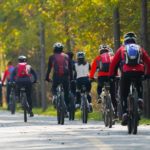 group of people riding a bicycle