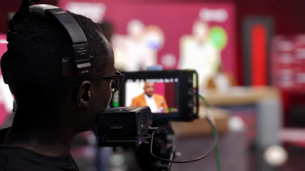 man realizing a television broadcast