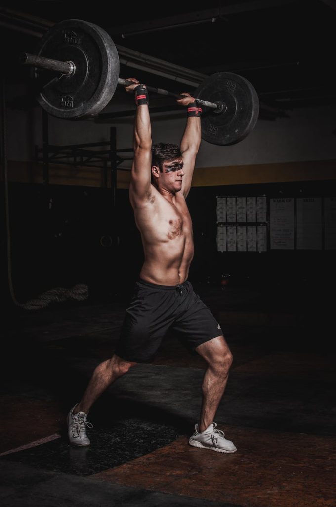 man lifting a barbell