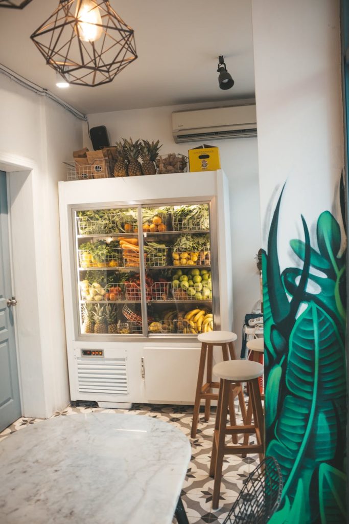 white refrigerator near door