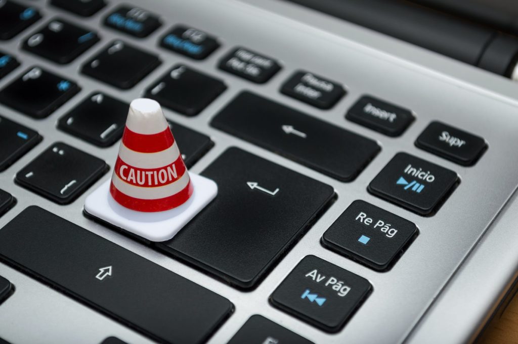 white caution cone on keyboard