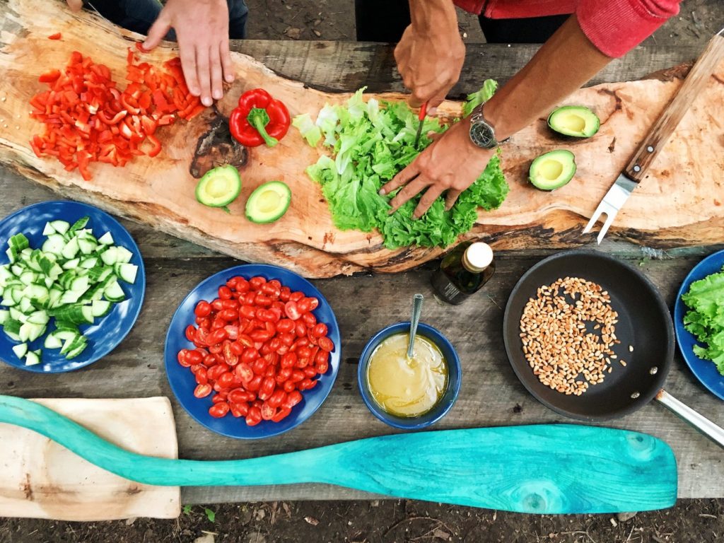 person holding sliced vegetable