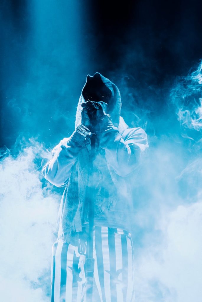 photo of person standing around smokes