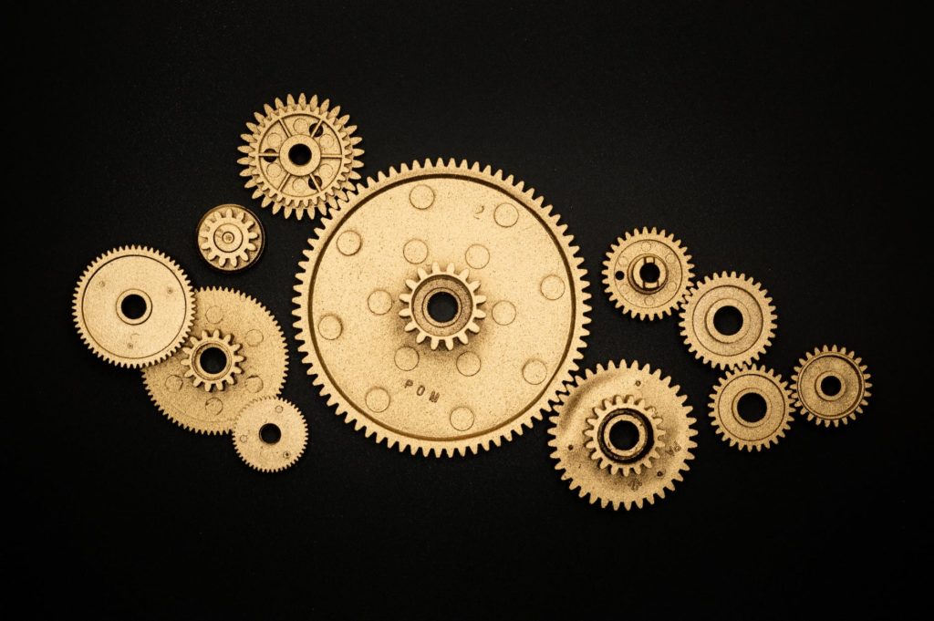 photo of golden cogwheel on black background