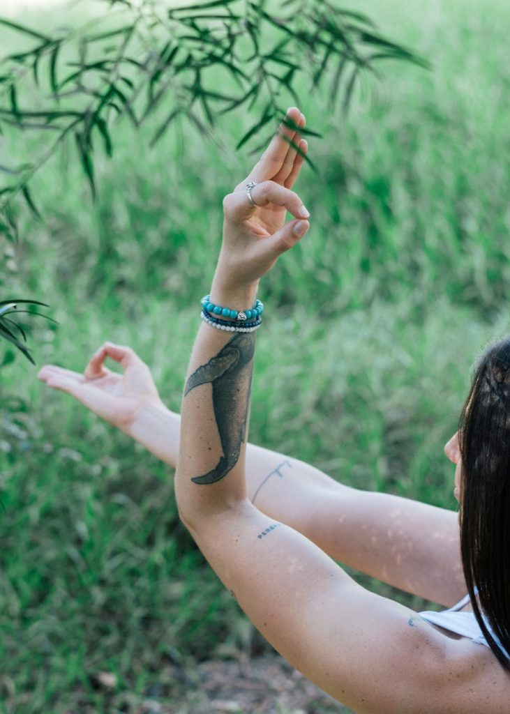 tranquil woman doing yoga in park