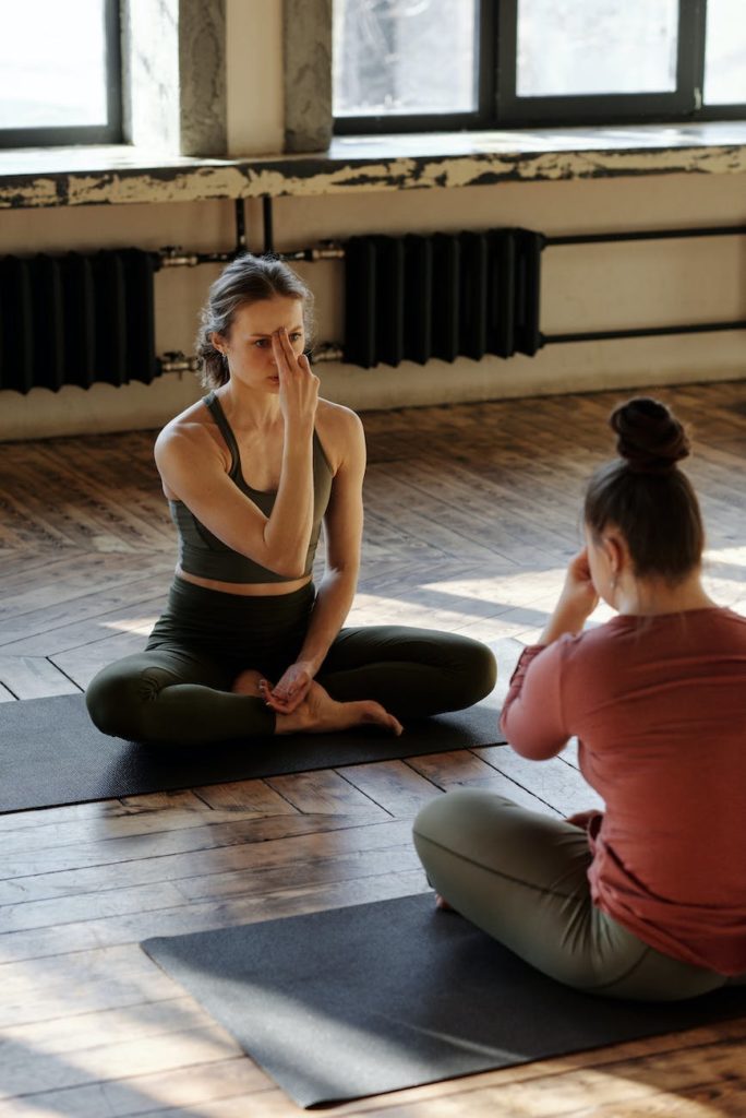 photo of women meditating together