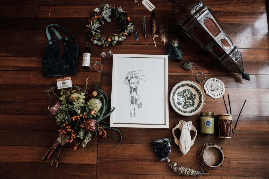 illustration among assorted fortune telling items with floral decor