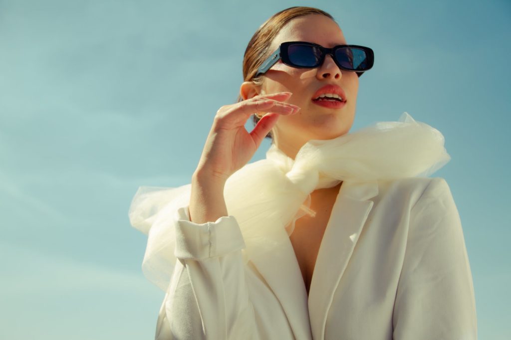 woman in trendy outfit under sunlight