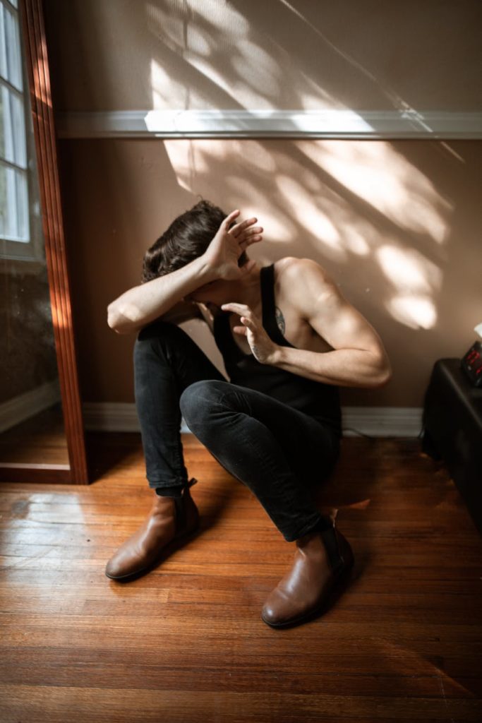 scared man on the wooden floor