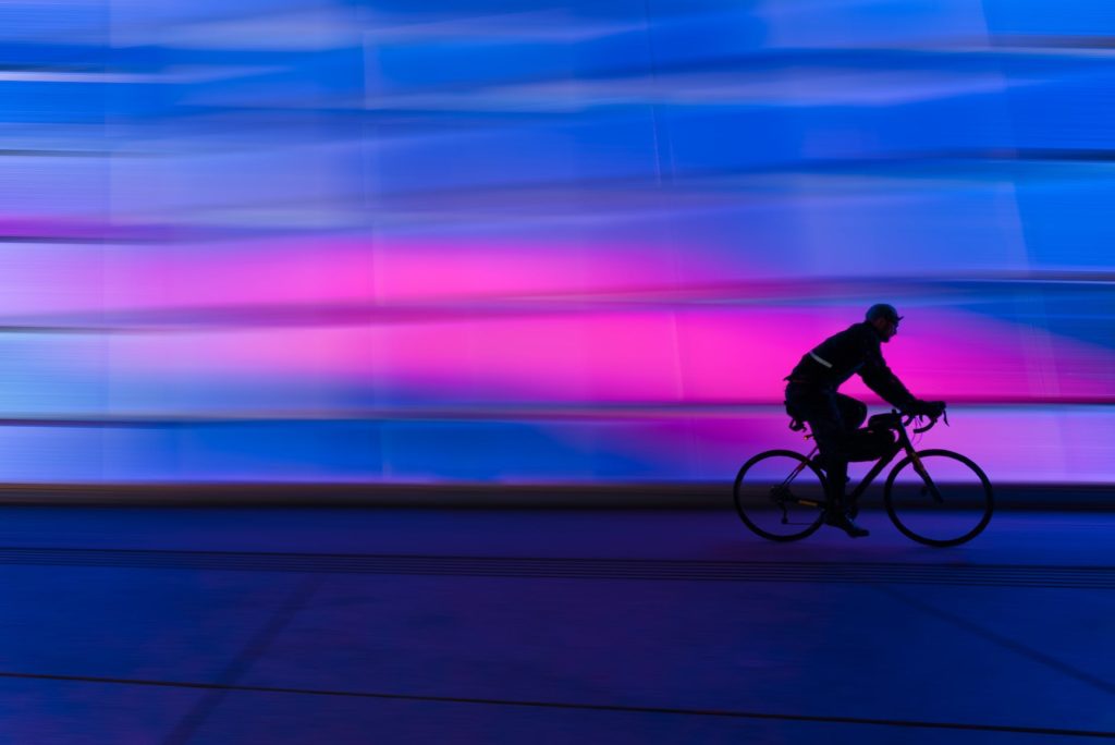 silhouette of person riding on commuter bike