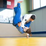 a judoka throwing an opponent