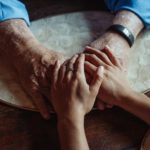 a close up shot of people holding hands