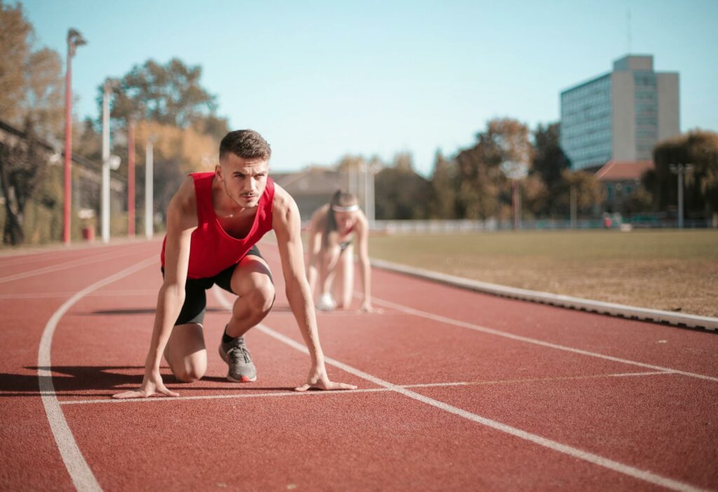 strong sportsmen ready for running on stadium